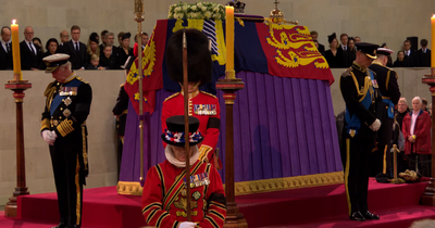 Emotional image shows Queen's children standing vigil at her coffin as the public walk past