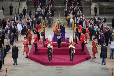 Queen’s children surround her coffin in sombre vigil