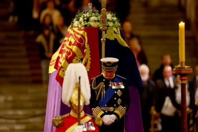 Queen Elizabeth's children guard coffin in solemn vigil