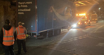 Amazon lorry becomes stuck under bridge in Salford