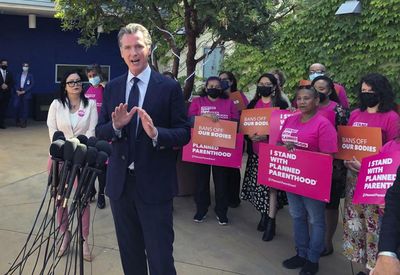 California governor’s ad campaign offers help to women in anti-abortion states