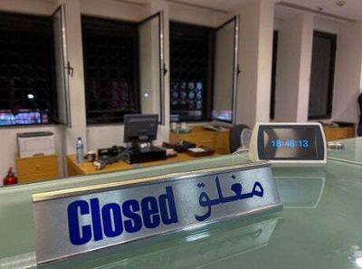 Lebanon to shut banks after string of raids by people taking out life savings