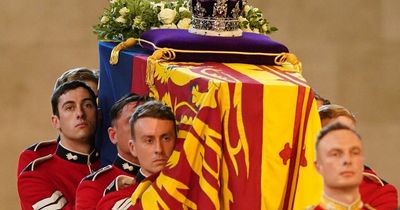 Man charges at Queen's coffin during late-night vigil before he is tackled to the ground and arrested