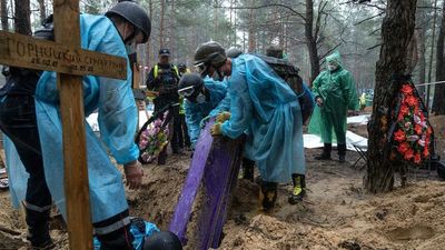 Ukraine says most of the 440 bodies found in Izium graves are civilians, amid fears of more burial sites