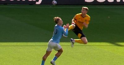 Jack Grealish suffers brutal flying kick to the stomach as Wolves' Nathan Collins sees red