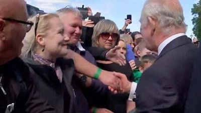 The King and Prince of Wales meet people waiting in the queue for Lying-in-state