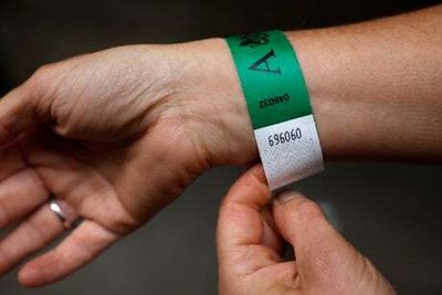 eBay to remove wristbands from lying in state queue being sold online