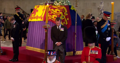 Harry appears in military uniform as Queen's grandchildren hold emotional vigil at her coffin