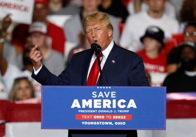 Trump news - live: Trump under fire for QAnon display at Ohio rally