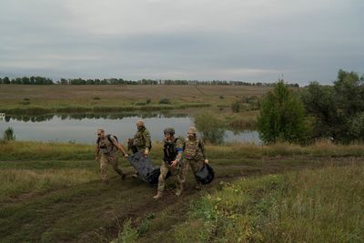 Near the Russian border, bodies still lie on the battlefield