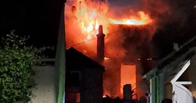 Dramatic images show firefighters tackling fireball flat blaze in Scots town