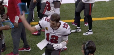 A frustrated Tom Brady furiously threw his helmet and tablet in sideline tantrum against Saints