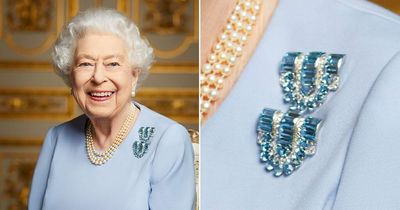 Queen honours father wearing sentimental aquamarine brooches in new unseen picture