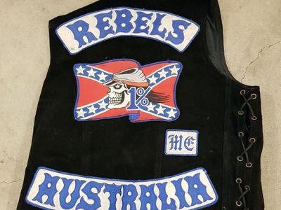 QLD Rebels members charged after raids