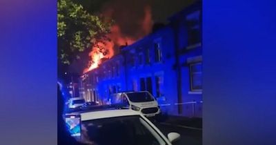 Dramatic moment fire tears through house as huge flames and smoke billow from roof