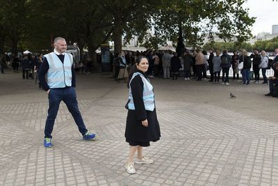 Priti Patel spotted marshalling queues to see Queen lying in state