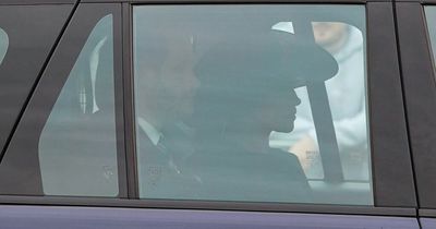 Meghan Markle arrives with Prince Harry dressed in black for Queen's funeral