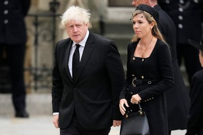 Carrie Johnson wears military-style dress as she accompanies Boris Johnson to Queen’s funeral