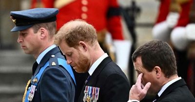 Emotional Prince Harry looks tearful at Queen's funeral alongside Prince William