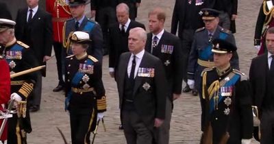 Prince Andrew 'fighting back tears' as he follows Queen's coffin in morning suit as siblings wear uniform