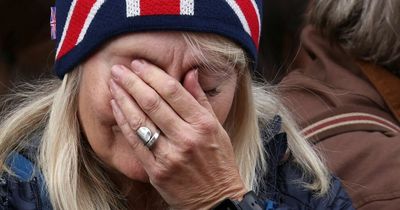 Mourners in tears as Queen's staff gather in front of Buckingham Palace to say farewell