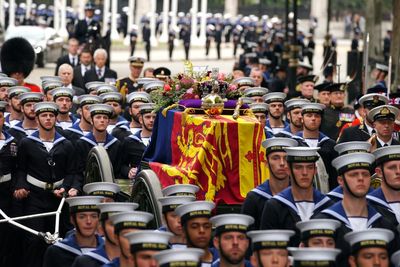 Sombre royals follow Queen’s coffin towed by sailors to Westminster Abbey