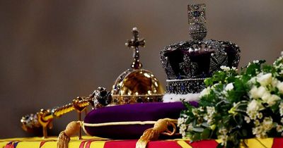 What's the significance of the orb and sceptre on the Queen's coffin?