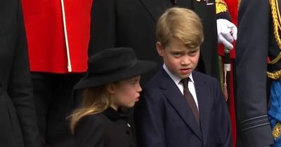 Princess Charlotte reminds George of royal protocol as they stand next to Queen's coffin