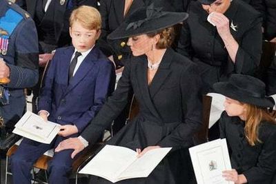 Prince George and Princess Charlotte among royals seen wiping away tears during Queen’s funeral