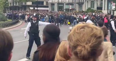 'Crazy' scenes at Queen's funeral as huge crowds surge past police to see procession