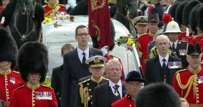 Queen's most dedicated servant 'Tall Paul' seen walking ahead of her hearse in funeral procession