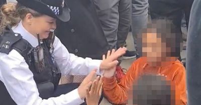 Police officer entertains kids waiting to see Queen's coffin in 'heartwarming' moment