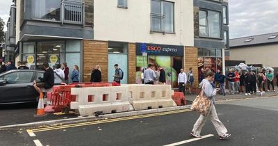 Shoppers queue around the corner to get into Tesco as it reopens after Queen's funeral