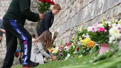 Mourners lay flowers at Windsor Castle