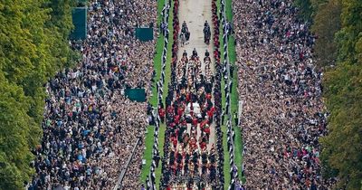 Crowds at Windsor witness Queen's final journey as she returns home to her corgis