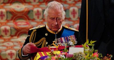 Emotional King Charles wells up as mourners sing God Save The King