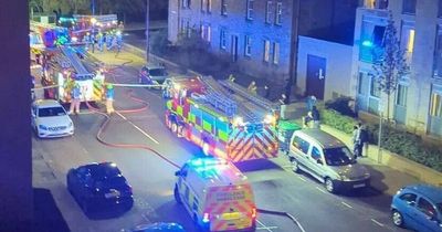 Two people rushed to hospital after fire at Edinburgh flat left street cordoned off