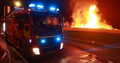 Major blaze rips into supermarket and flats as fire crews fight to save school