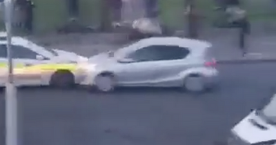 Shocking scenes in Dublin as gardai 'rammed' twice before cars left to burn in local park