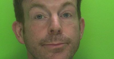 Mugshot of smirking stalker Alex Belfield who made 'other people’s lives a misery'