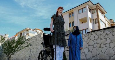 World’s tallest woman who stands more than 7ft tall smashes three new records