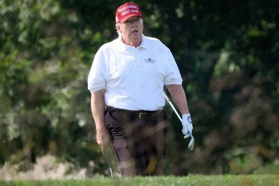 Trump aides tasked with following him around golf course and giving ‘positive reinforcement’, reporter says