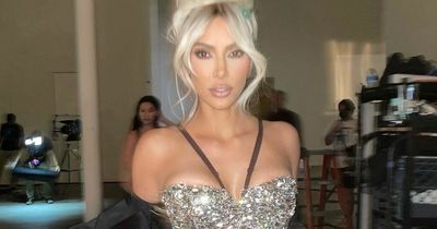 Kim Kardashian flaunts weight loss in sparkling corset after setting sights on new man