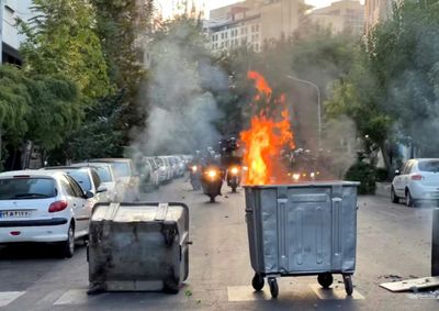 Six reported killed as Iran protests spread over woman's death