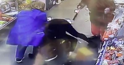 Granny pins down masked robber armed with hammer in daring CCTV video