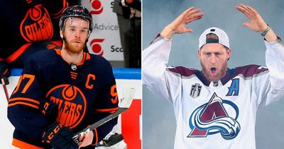 Connor McDavid reacts as Nathan MacKinnon passes him to become NHL's highest-paid player