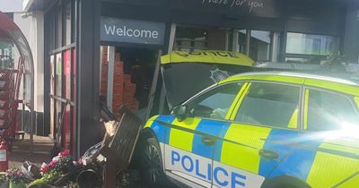 Watch as PSNI car crashes into Spar shop in Lisburn