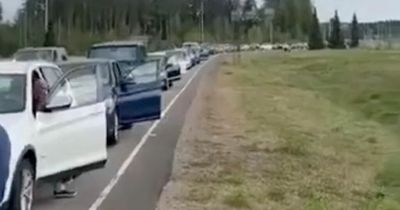 Mass exodus with queues at Russia border as Vladimir Putin orders 300,000 into army