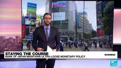 As Federal Reserve raises rates, Bank of Japan stays put