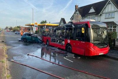 London bus bursts into flames after rush hour collision with two cars in Surrey